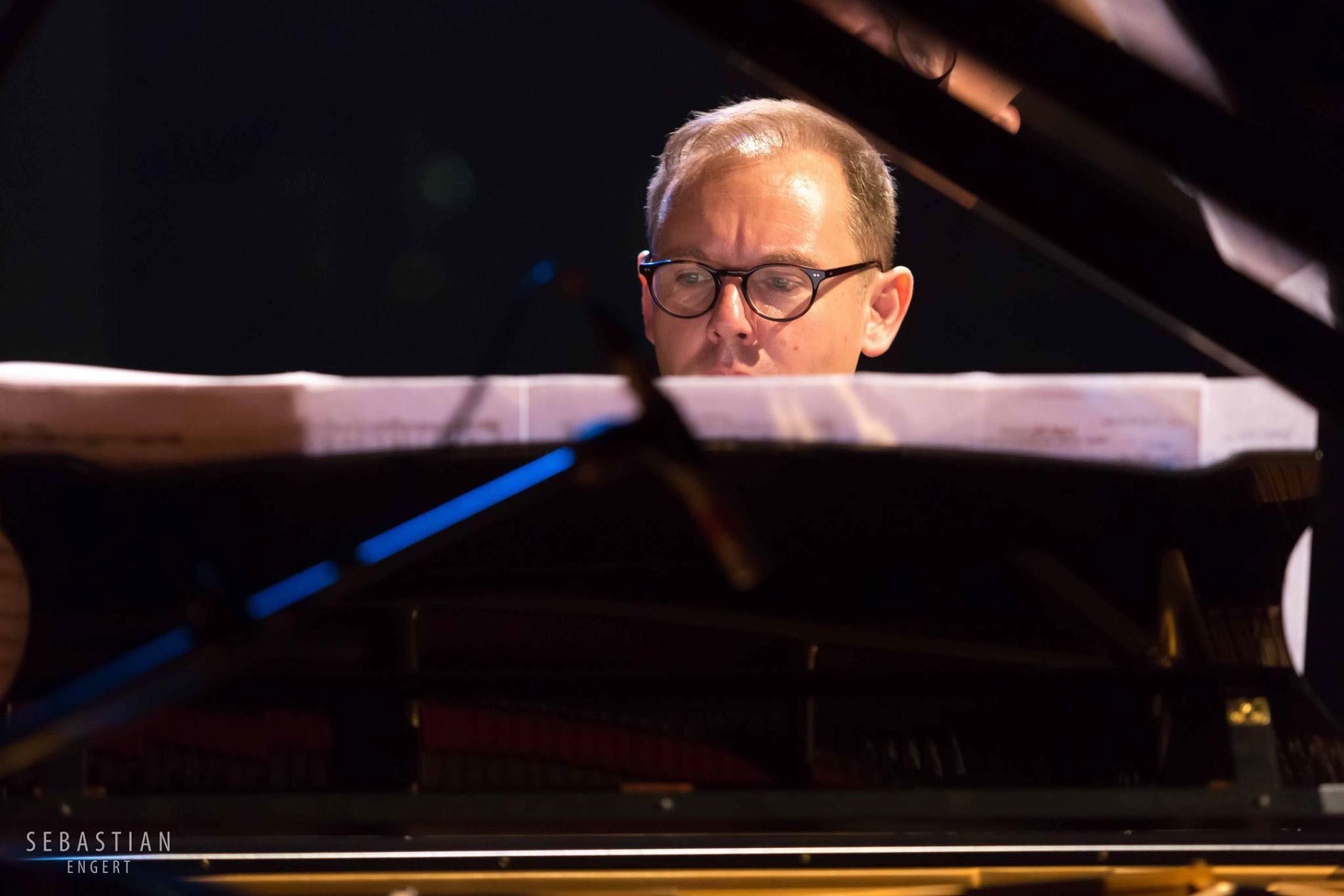 Simon at the piano — photo by Sebastian Engert